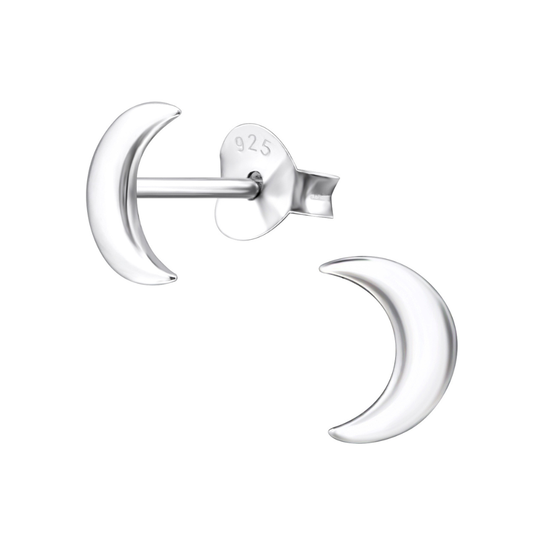 A pair of crescent moon-shaped silver stud earrings on a white background.